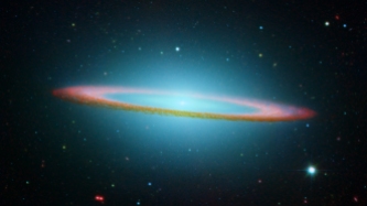 NASA's Spitzer and Hubble Space Telescopes joined forces to create this striking composite image of one of the most popular sights in the universe. Messier 104 is commonly known as the Sombrero galaxy because in visible light, it resembles the broad-brimmed Mexican hat. However, in Spitzer's striking infrared view, the galaxy looks more like a "bull's eye."â¨â¨In Hubble's visible light image, only the near rim of dust can be clearly seen in silhouette. Recent observations using Spitzer's infrared array camera uncovered the bright, smooth ring of dust circling the galaxy, seen in red. Spitzer's infrared view of the starlight, piercing through the obscuring dust, is easily seen, along with the bulge of stars and an otherwise hidden disk of stars within the dust ring.â¨â¨Spitzer's full view shows the disk is warped, which is often the result of a gravitational encounter with another galaxy, and clumpy areas spotted in the far edges of the ring indicate young star-forming regions.â¨â¨The Sombrero galaxy is located some 28 million light-years away. Viewed from Earth, it is just six degrees south of its equatorial plane. Spitzer detected infrared emission not only from the ring, but from the center of the galaxy too, where there is a huge black hole, believed to be a billion times more massive than our Sun.â¨ This magnificent galaxy has a diameter that is nearly one-fifth the diameter of the full Moon. Image courtesy of NASA's Spitzer and Hubble Space Telescope.